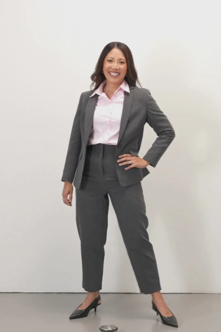 Josie Tailored Blazer - Charcoal - Woman wearing a gray suit with a pink tailored shirt on a white background