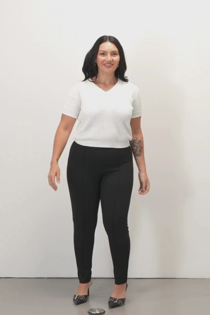Zoe Ponte Leggings - Black - Daisy Short Sleeve Knit Top - White - Woman wearing black Ponte leggings and white knit top on a white background