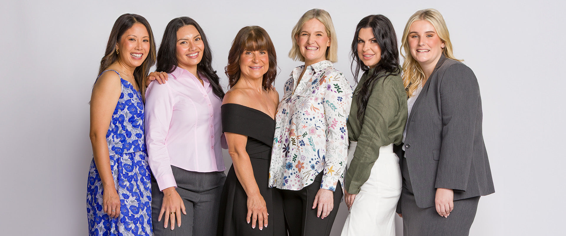 Style By Kezy team members wearing petite tailored clothing designed for women 158cm and under, showcasing the brand behind the collection.