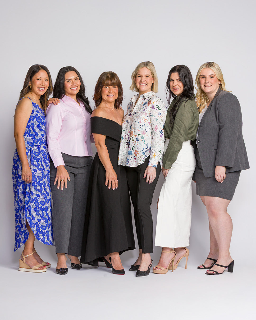 Style By Kezy team members wearing petite tailored clothing designed for women 158cm and under, showcasing the brand behind the collection.